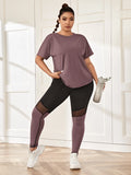Set sportivo donna taglie forti con maglietta in rete e leggings sportivi con tasca per il telefono