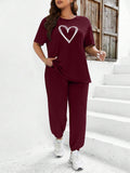 Set di pantaloni casual e top a maniche corte con stampa a cuore, adatto a taglie forti