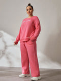 Set sportivo casual composto da top a maniche lunghe con scollo rotondo e stampa a lettere e pantaloni