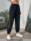 Pantaloni capri a vita elastica in rete di colore unito