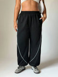 Pantaloni larghi con coulisse per donne taglia comoda, a blocchi di colore con righe e tasche