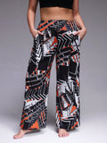 Pantaloni casual larghi con vita elastica e stampa colorata, adatti per taglie comode, con tasche laterali