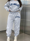 Set casual da 2 pezzi, composto da felpa e pantaloni della tuta con stampa di lettere, taglie comode