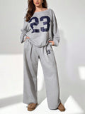 Set di felpa oversize a maniche lunghe con spalle scoperte e pantaloni larghi per taglie forti