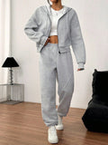Tuta sportiva con felpa con cappuccio e pantaloni con chiusura lampo, grigia